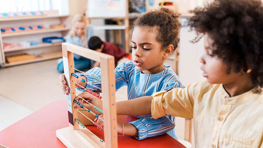 Two preschoolers playing with toys